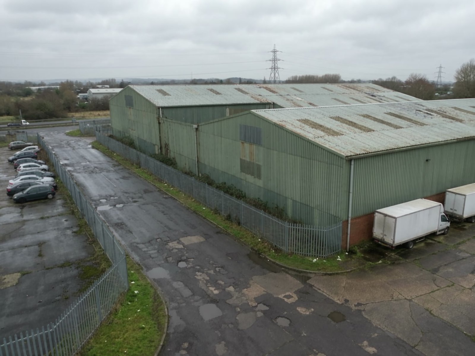 Still frame: existing industrial warehouse aerial view before the planning CGI process film plays