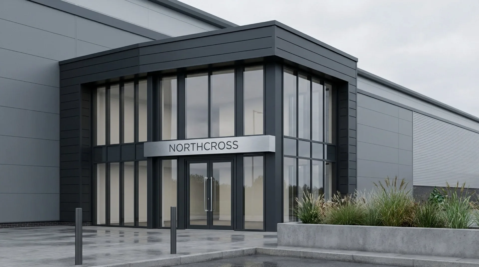 Warehouse main entrance CGI showing corporate signage on the architrave, fascia branding panel, deep blue door colour, glazed entrance doors, and brushed steel door furniture